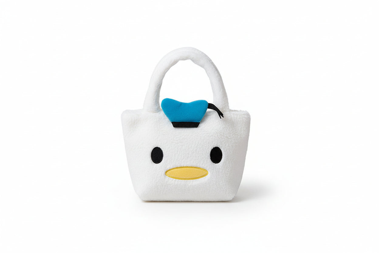 Plush bag shaped like a cartoon character with a blue bow on a white background