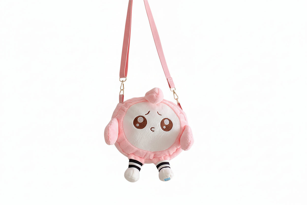 Pink plush backpack with a cute face design on a white background