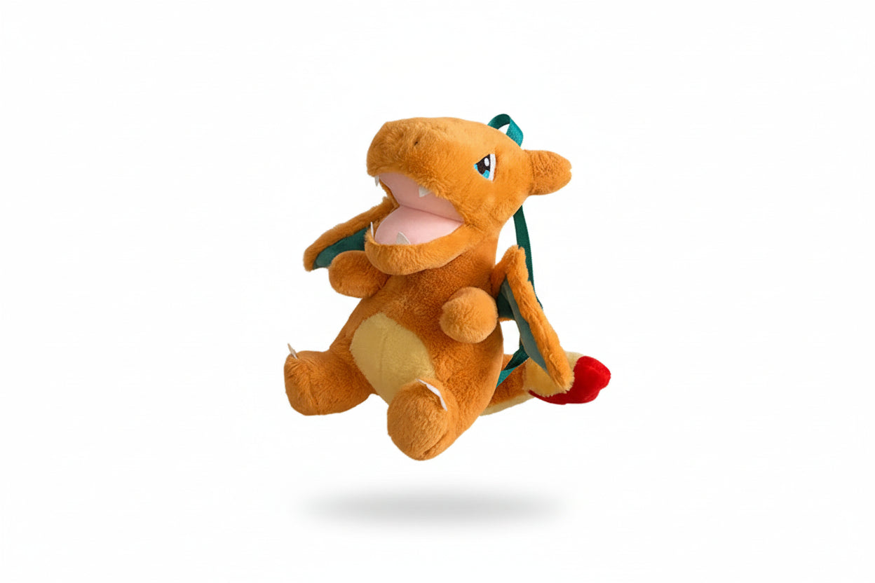 Plush toy of a dragon-like creature on a white background