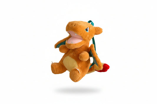 Plush toy of a dragon-like creature on a white background