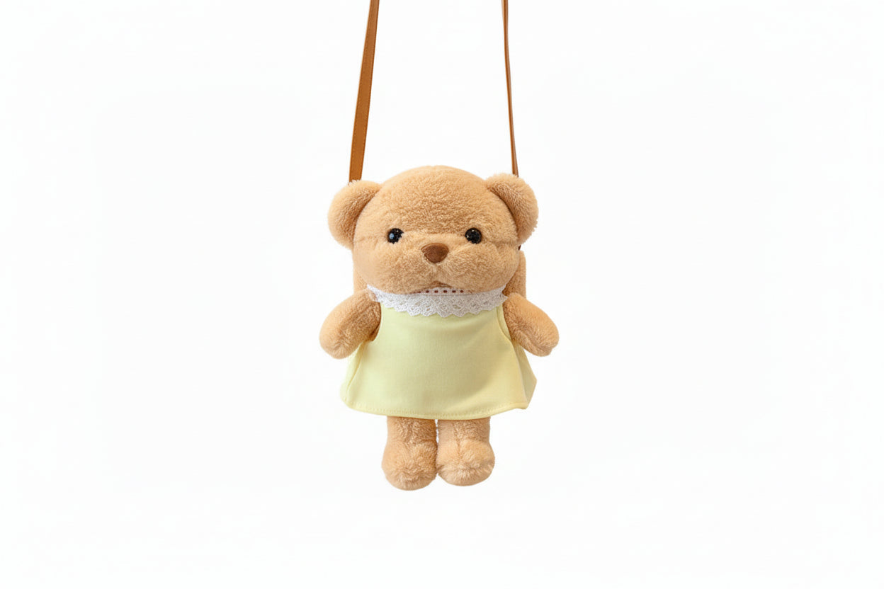 Plush dog toy with a yellow dress on a white background