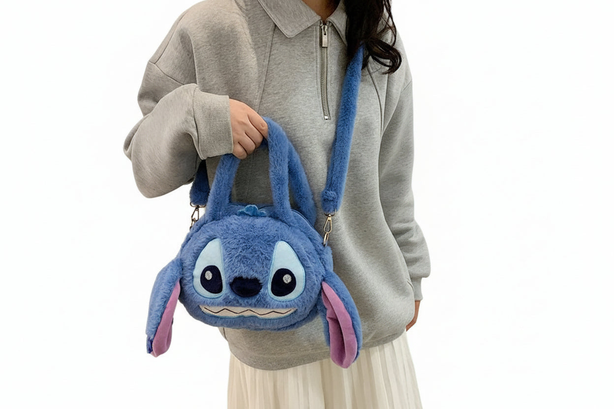 Blue plush bag shaped like a cartoon character on a white background
