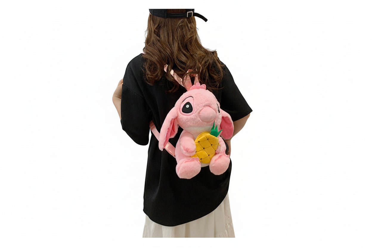Person wearing a black shirt with a pink plush backpack featuring a pineapple.