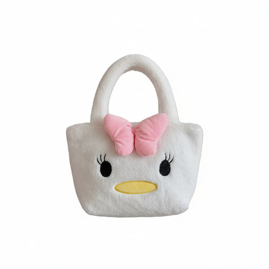 Person holding a plush bag shaped like a cartoon character with a pink bow.