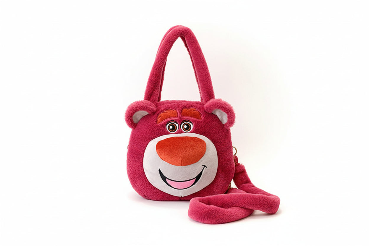 Pink plush bag with cartoon face design on a white background